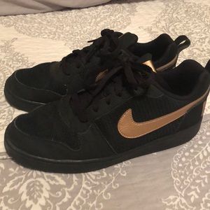 Black and rose gold Nike sneakers
